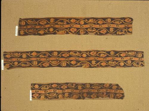 Polychrome tapestry band in three fragments, with a plant scroll inhabited by a variety of marine animals