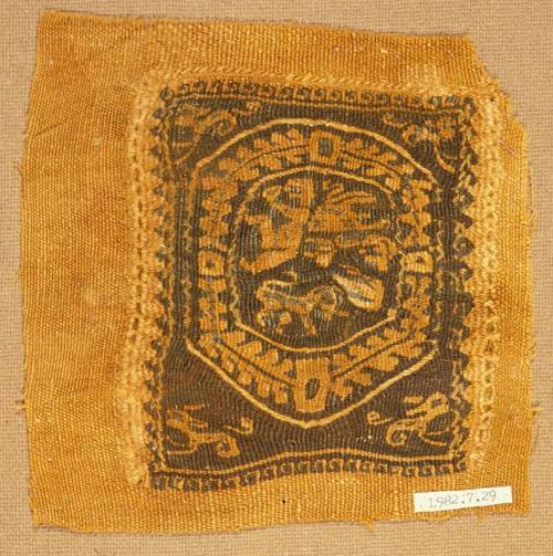 Monochrome tapestry square with putti framed by a jewelled wreath