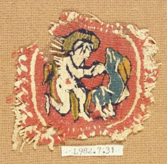 Polychrome tapestry roundel with a putto wrestling an animal