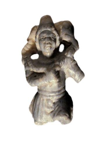 Statuette of a shepherd carrying a sheep
