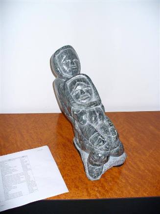 Woman seated in front of a Man