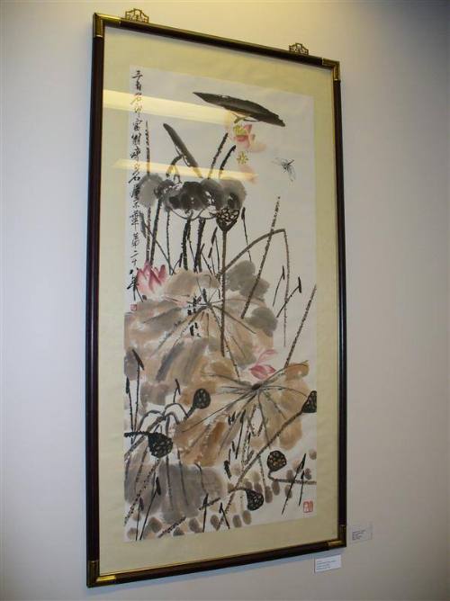 abstract Chinese brush painting of lotus flowers, leaves and dragonfly