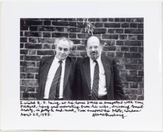 R.D. Laing and Allen Ginsberg in front of brick wall 1, London