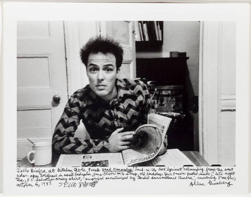 Jello Biafra at table with newspaper 1
