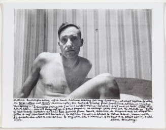 William Burroughs sitting upright, 206 E 7th street