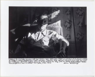 William Burroughs, sitting in arm chair, dramatic contrast in light, NY September