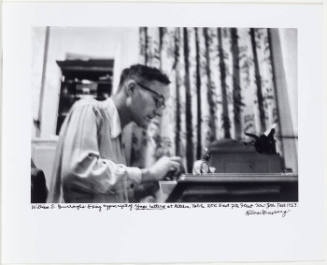 William Burroughs at typewriting fixing Yage letters typescript, 206 East 7th Street New York, Fall