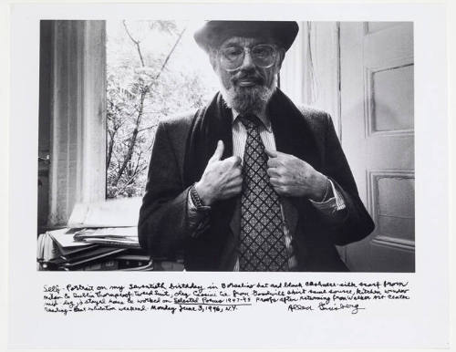 Allen Ginsberg self portrait on 70th birthday, June 3rd, 1996, wearing hat and tie