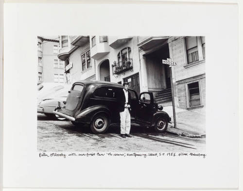 Peter Orlovsky in front of car, Hodges Street