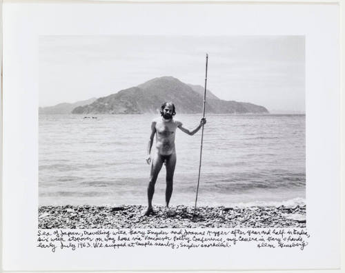 Allen Ginsberg naked holding stick on beach