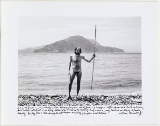 Allen Ginsberg naked holding stick on beach