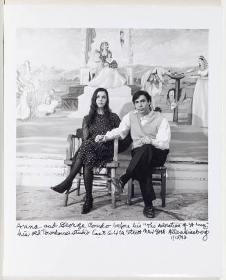 Portrait of George and Anna Condo, seated together, holding hands with "The Adoration of Saint Lucy" behind