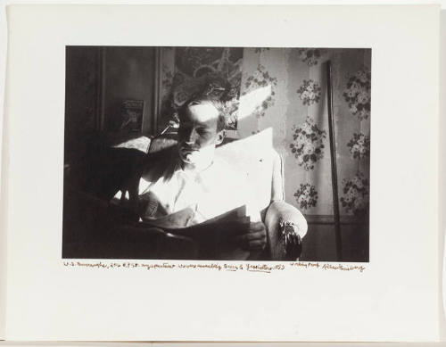 William Burroughs, sitting in arm chair, dramatic contrast in light, NY September