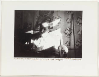 William Burroughs, sitting in arm chair, dramatic contrast in light, NY September