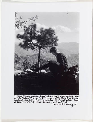 Joanne Kyger sitting on ledge with book, in Almora, visiting Lama Govinda, March