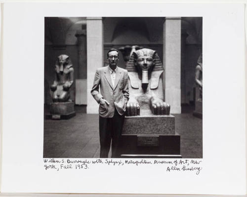 William Burroughs in front of sphinx at the Metropolitan Museum of Art, NYC