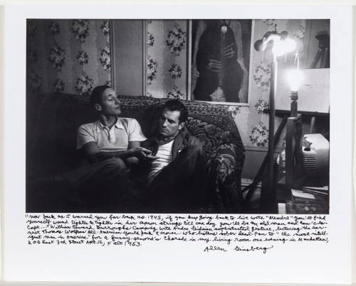 William Burroughs and Jack Kerouac both on couch, Burroughs' palm up