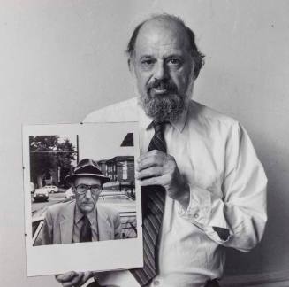 Allen Ginsberg with his own portrait of Burroughs